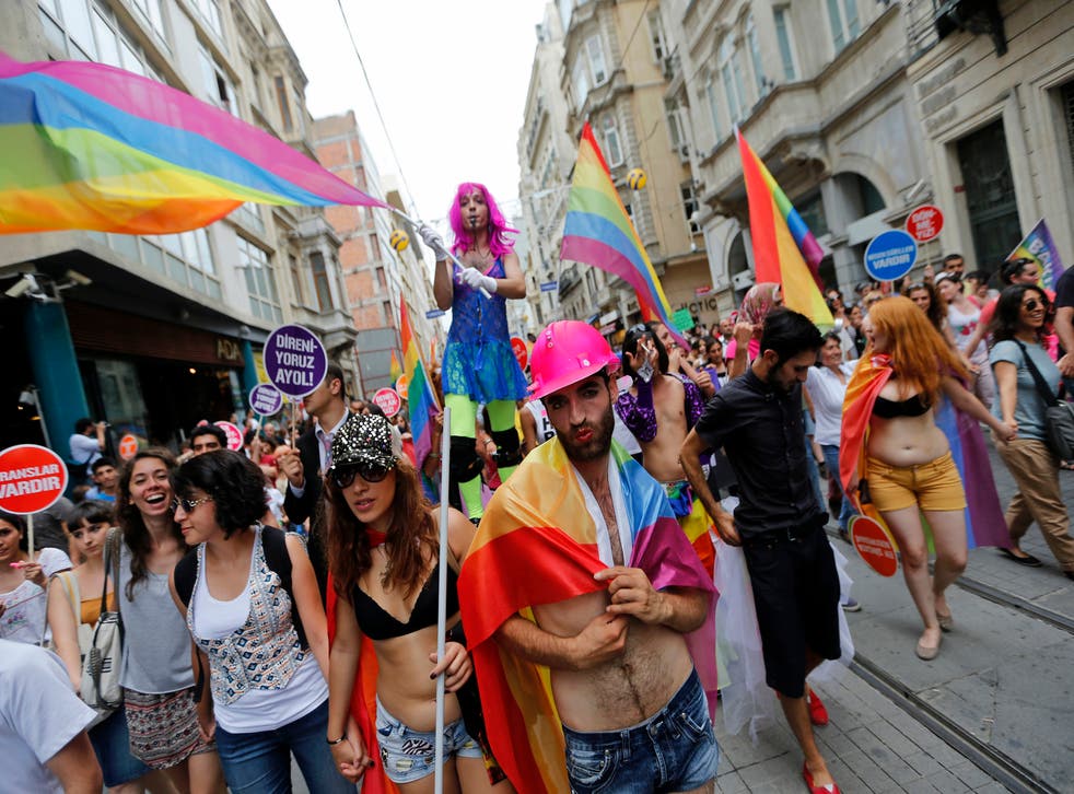 People march during a gay pride parade in central Istanbul June 30, 2013. Tens of thousands of anti-government protesters teamed up with a planned gay pride march in Istanbul.