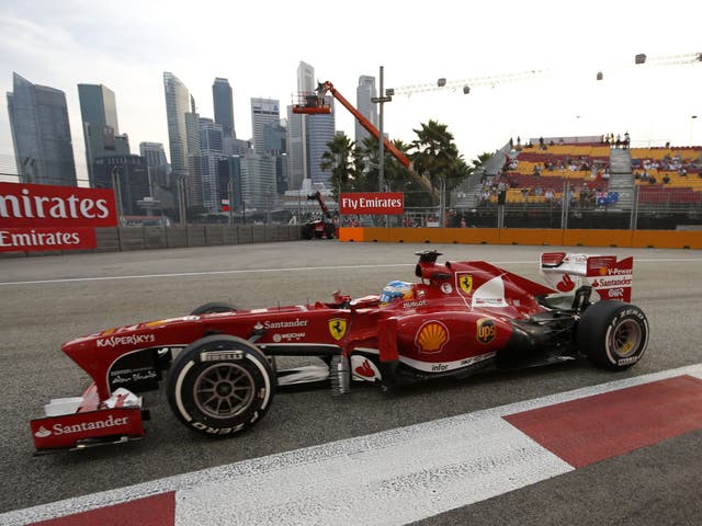 Fernando Alonso in his Ferrari during practice yesterday for tomorrow's Singapore Grand Prix
