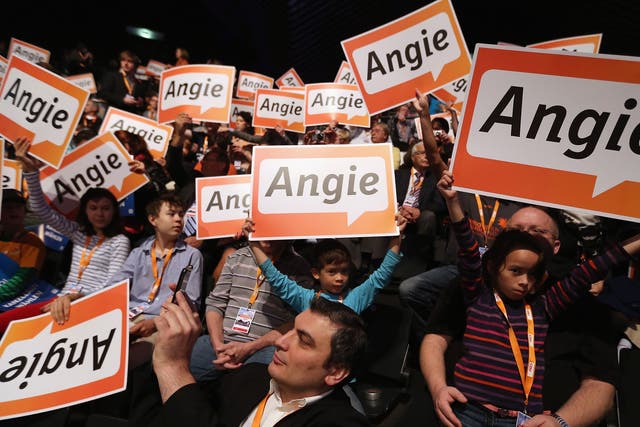 Votes for Angela: But will they be enough? Supporters in Berlin, yesterday