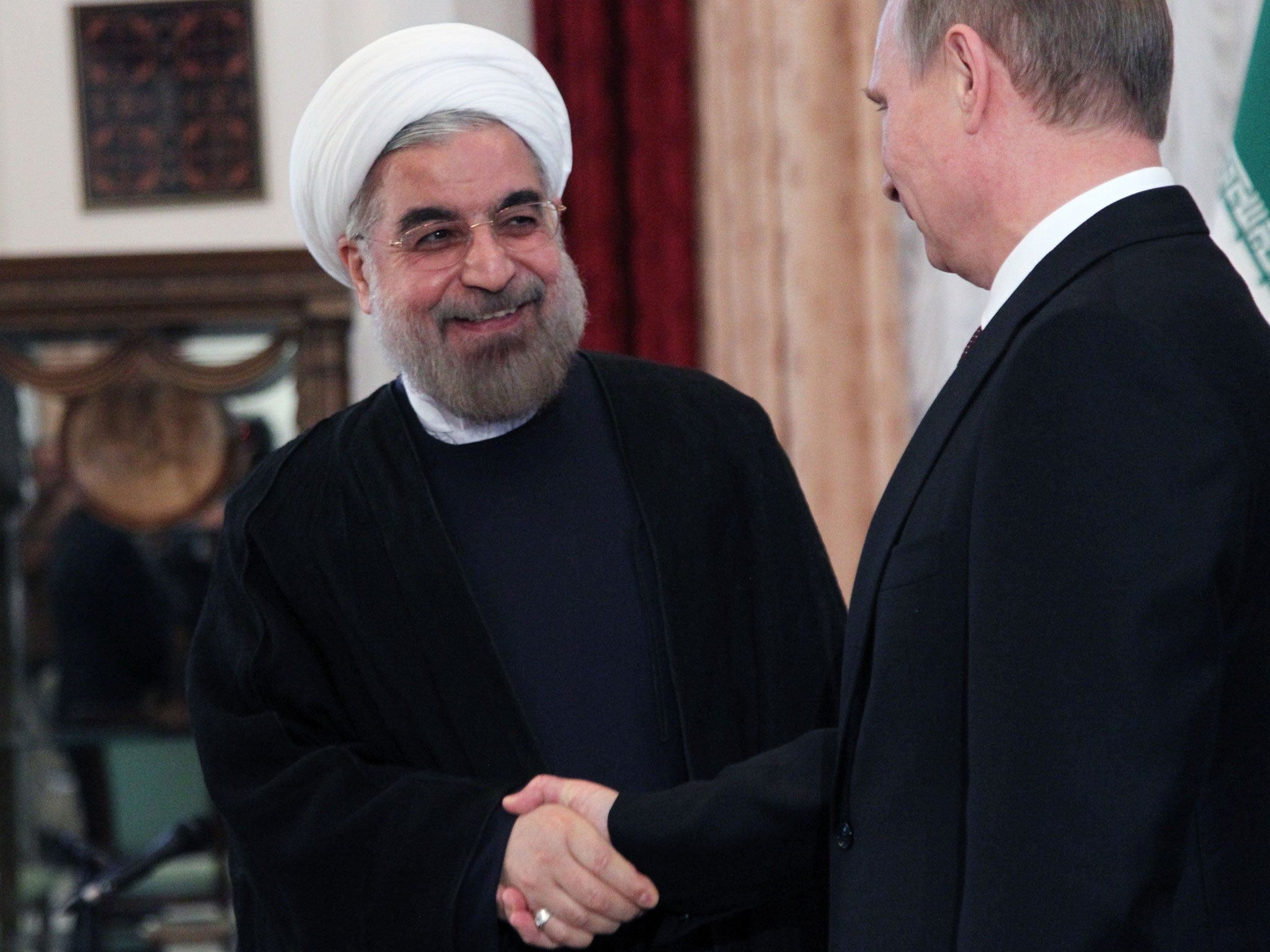 Firm friends: Mollifying words from Presidents Hassan Rouhani, and Vladimir Putin have not changed matters in Syria