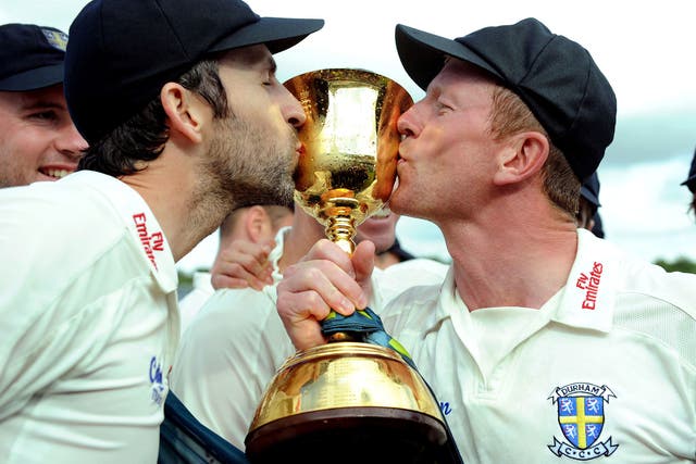 Win bonus: Graham Onions (on the left) with Paul Collingwood after Durham win title