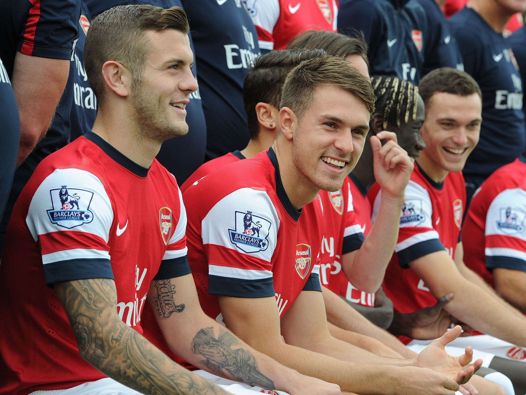 Jack Wilshere sitting alongside Aaron Ramsey at the Arsenal squad photo shoot