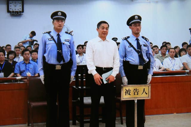 A screen shows the picture of the sentence of Chinese politician Bo Xilai (Center) on September 22, 2013 in Beijing, China. The Jinan Intermediate People's Court announced Bo Xilai, former member of the CPC Central Committee Political Bureau, was sentence