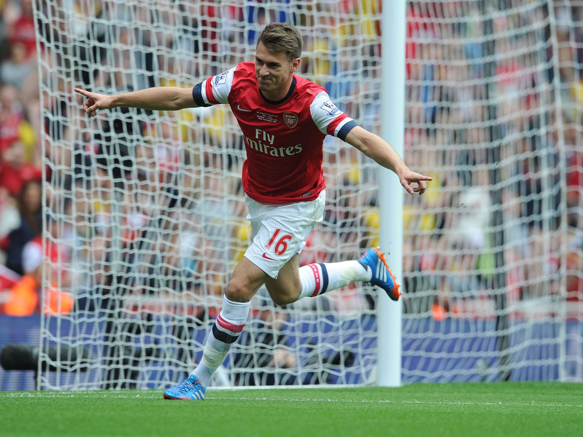 LONDON, ENGLAND - SEPTEMBER 22: Aaron Ramsey of Arsenal celebrates scoring a goal during the Barclays Premier League match between Arsenal and Stoke City at Emirates Stadium. GETTY IMAGES