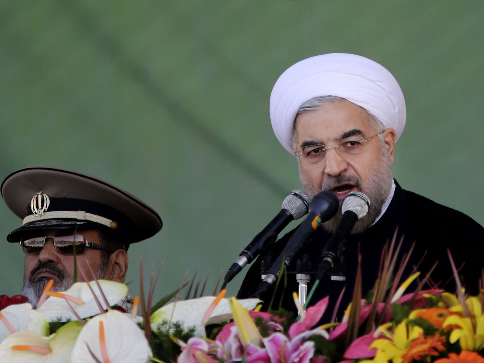 Iran's President Hassan Rouhani, gives a speech during an annual military parade in Tehran, Iran