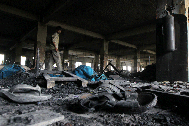 The charred remains of the Tazreen Fashion factory after a fire last November that killed 110 workers. It is claimed that factory managers had prevented employees from escaping the blaze.