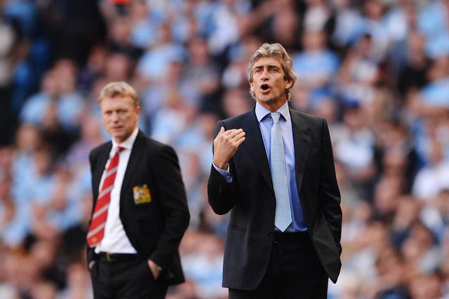 David Moyes manager of Manchester United (L) and Manuel Pellegrini manager of Manchester City