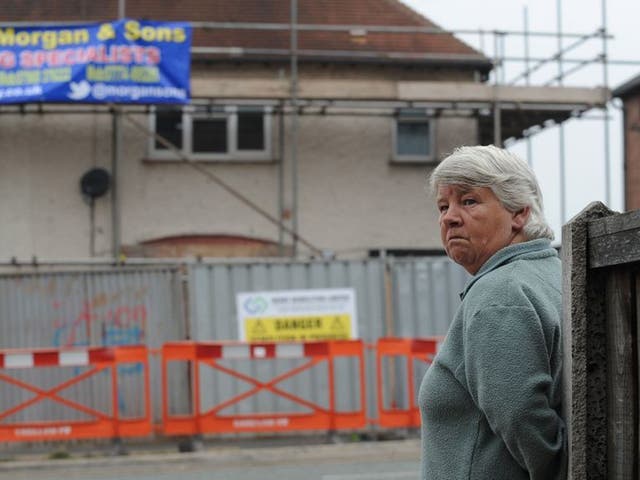 Vera Duffy looks on as the house where her six grandchildren died in a fire set by Mick and Mairead Philpott is prepared for demolition