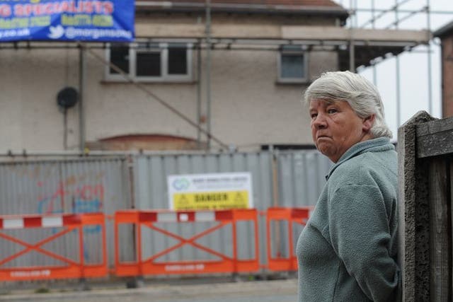Vera Duffy looks on as the house where her six grandchildren died in a fire set by Mick and Mairead Philpott is prepared for demolition