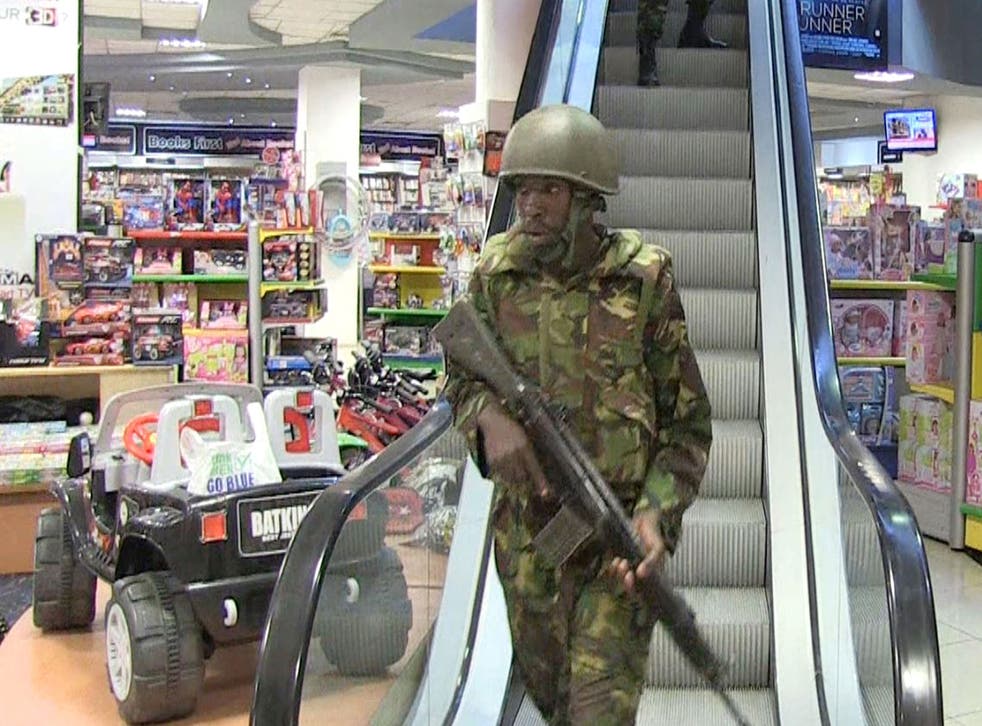 An image grab taken from AFP TV shows military forces taking position inside a shopping mall following an attack by masked gunmen in Nairobi on September 21, 2013