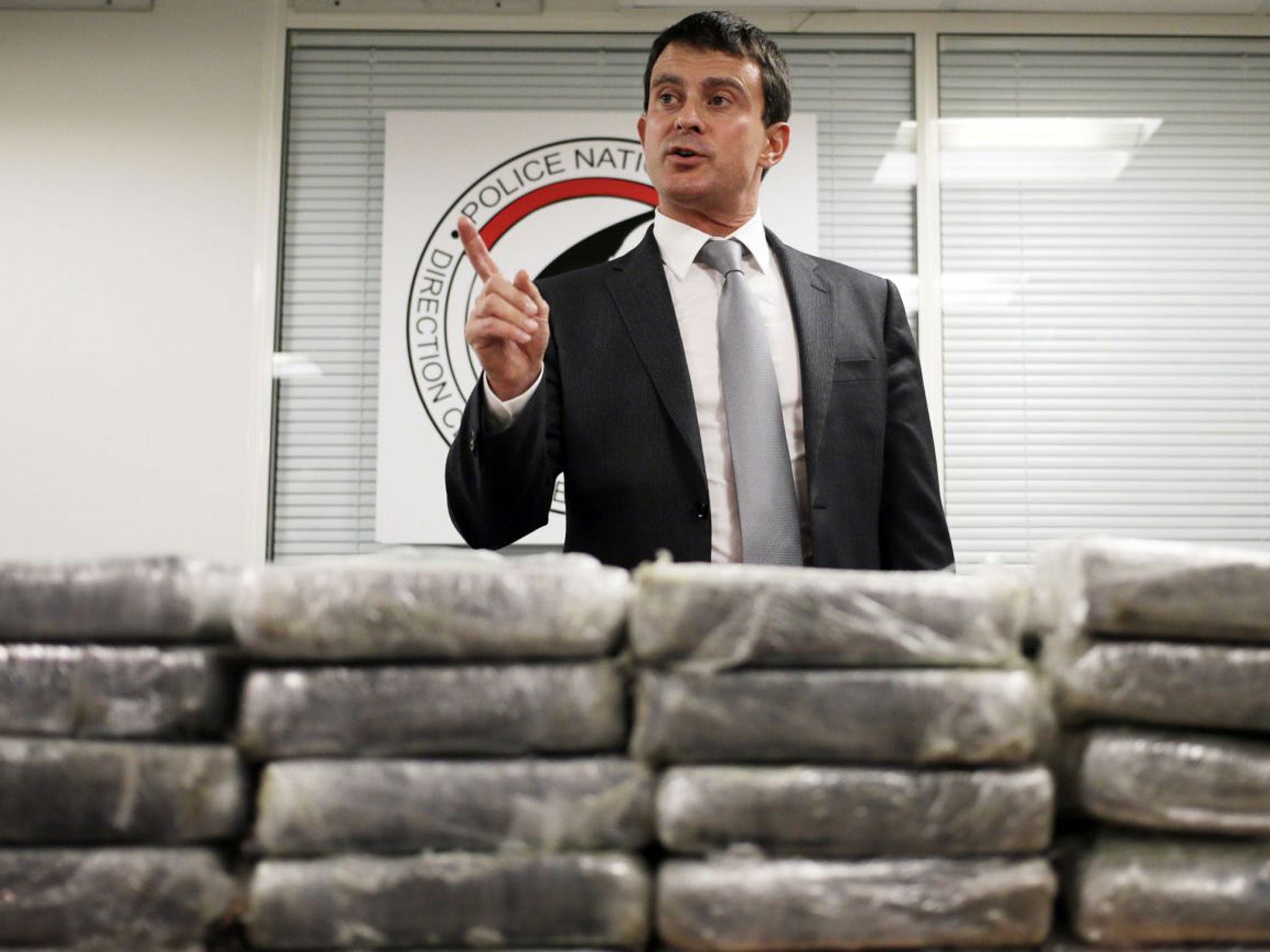 French Interior minister Manuel Valls behind cocaine seized by police from an Air France flight to Paris