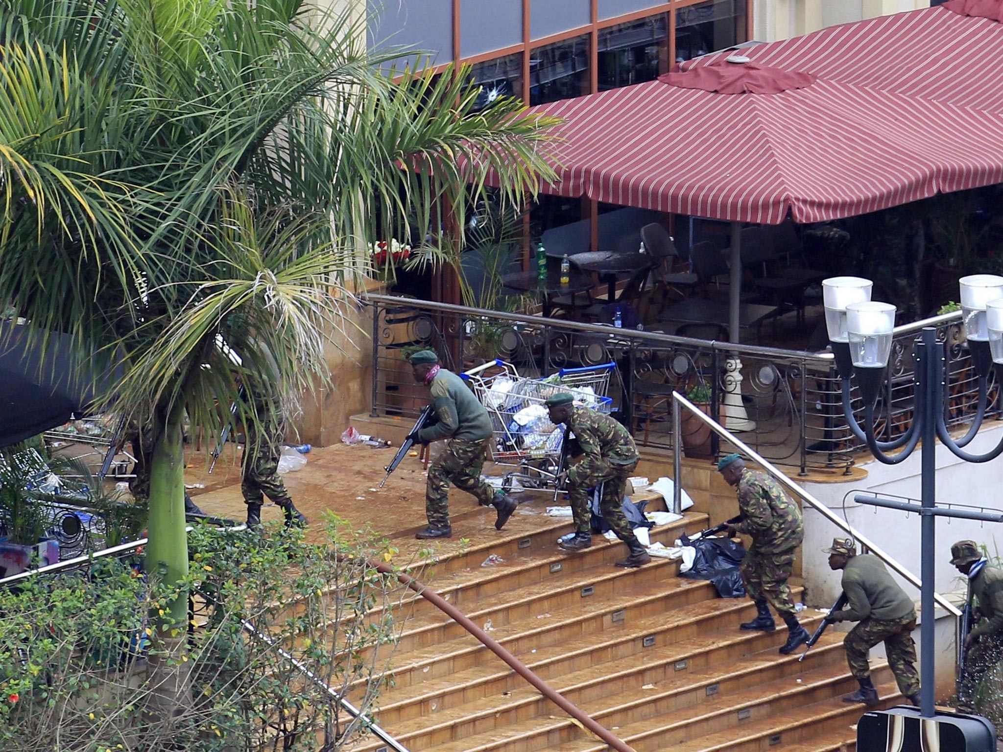 24 September 2013: Kenya Defence Forces soldiers take their position at the Westgate shopping centre, on the fourth day since militants stormed into the mall, in Nairobi