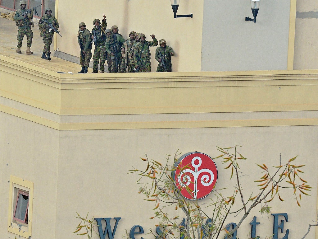 A Kenyan soldier gives the thumbs up after clearing the top floor balcony and interior of the Westgate mall in Nairobi
