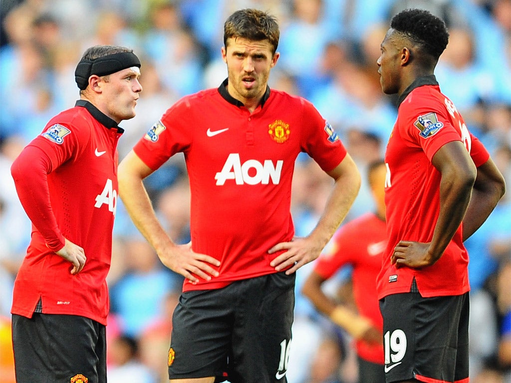 Carrick, centre, with Rooney and Welbeck