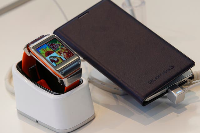 The Galaxy Gear Smartwatch and Galaxy Note 3 phablet picture together at the IFA tradeshow in Berlin.