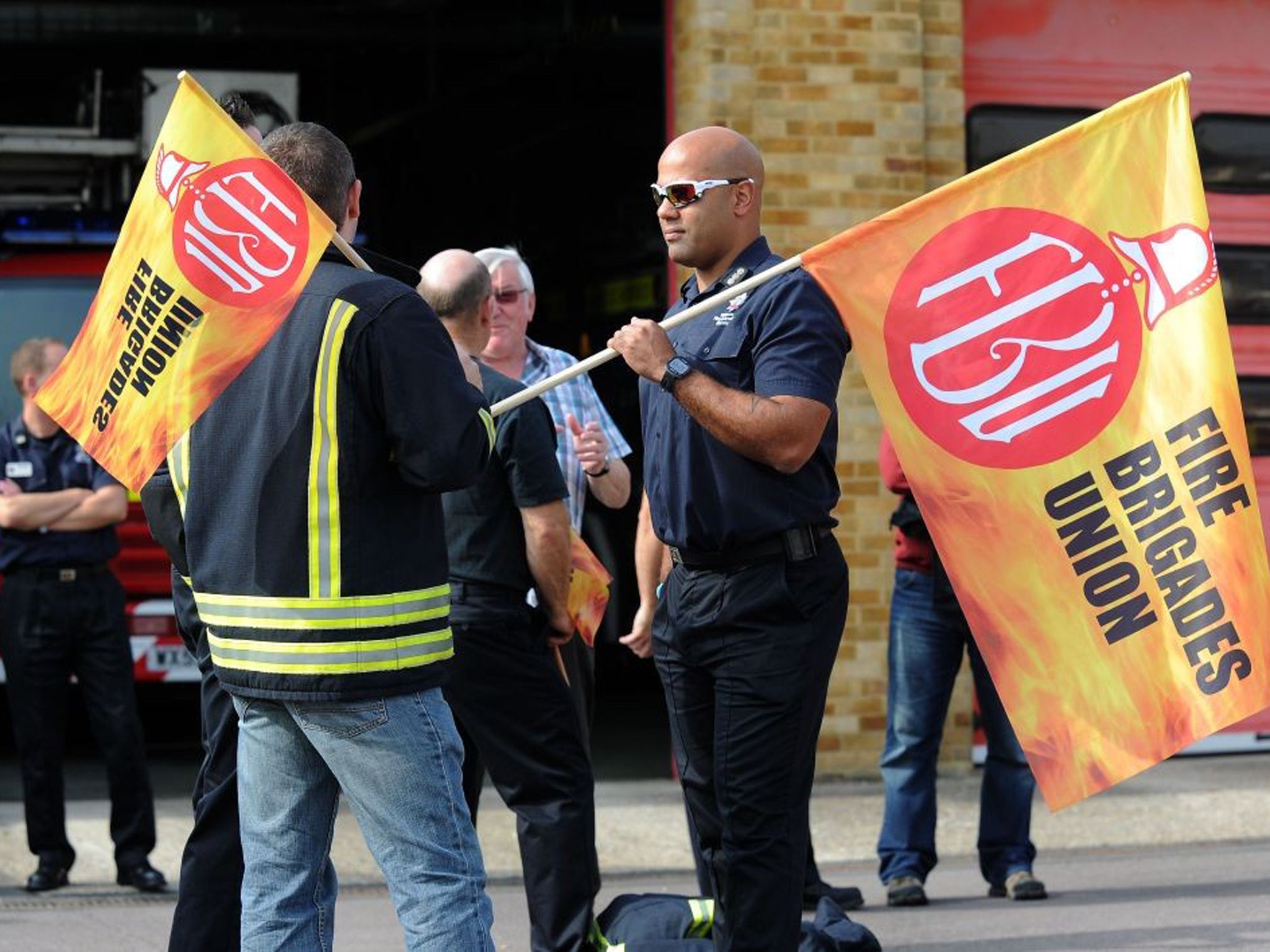 Firefighters and Fire Service staff from Wiltshire gather on the picket line outside