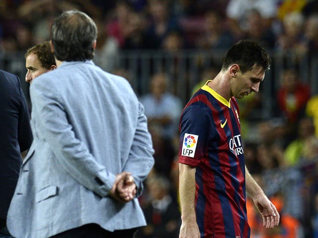 Lionel Messi (right) says he did not make a gesture after being taken off by coach Gerardo Martino (left)