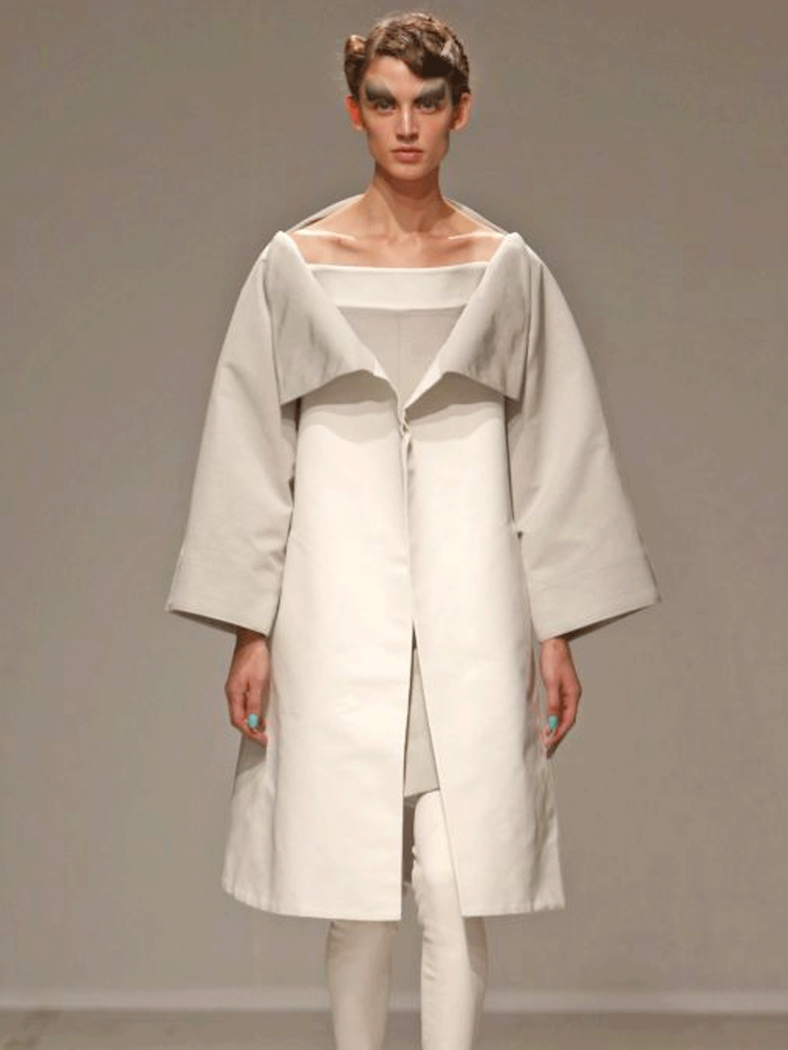 A model presents a creation by designer Gareth Pugh as part of his Spring/Summer 2014 collection during Paris Fashion Week