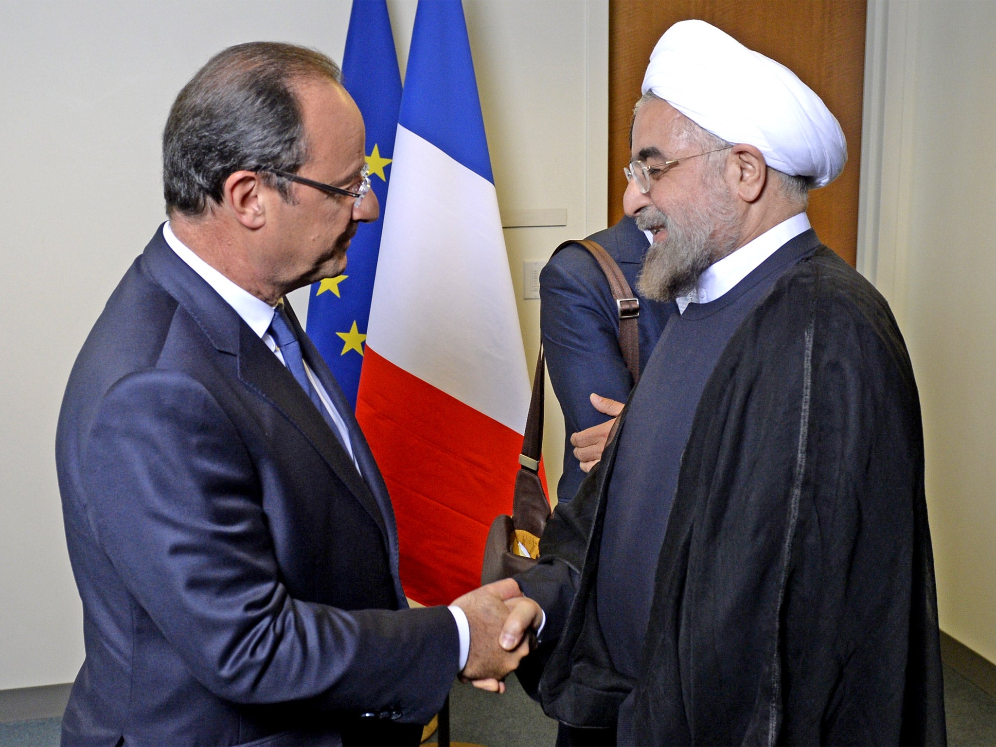 Hassan Rouhani and François Hollande find time for a handshake (Getty)