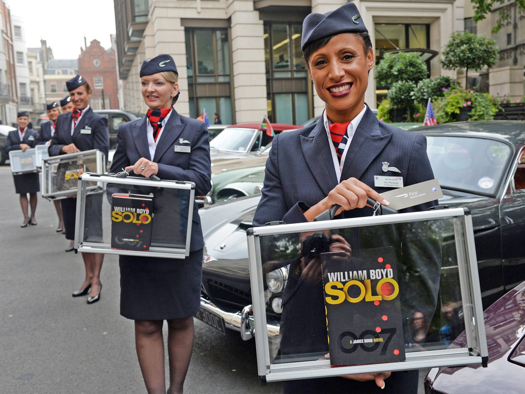 British Airways flight attendants hold copies of ‘Solo’ at the launch