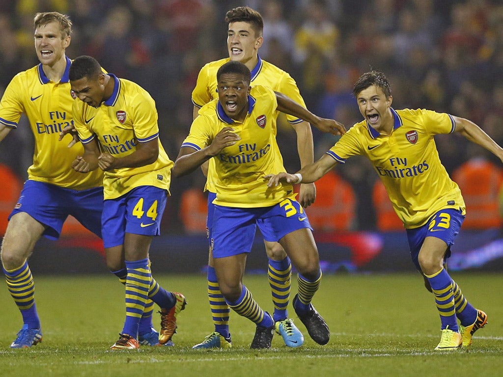 The Arsenal players celebrate following their shootout victory