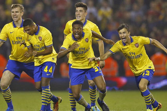 The Arsenal players celebrate following their shootout victory