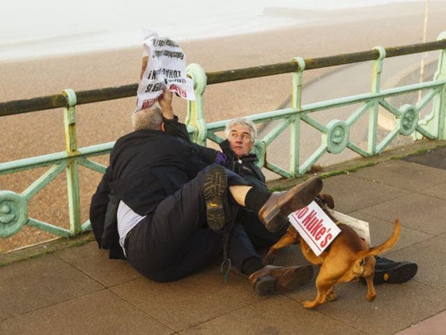 Political blogger Iain Dale (left) scuffling with Stuart Holmes (right) on Brighton seafront