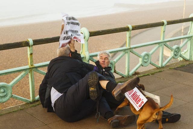 Political blogger Iain Dale (left) scuffling with Stuart Holmes (right) on Brighton seafront