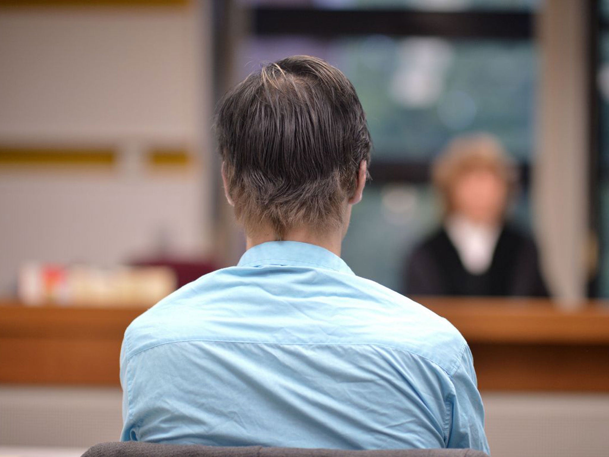 Robin van Helsum seen across a Berlin courtroom
