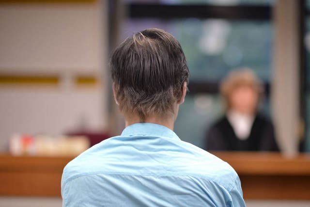 Robin van Helsum seen across a Berlin courtroom