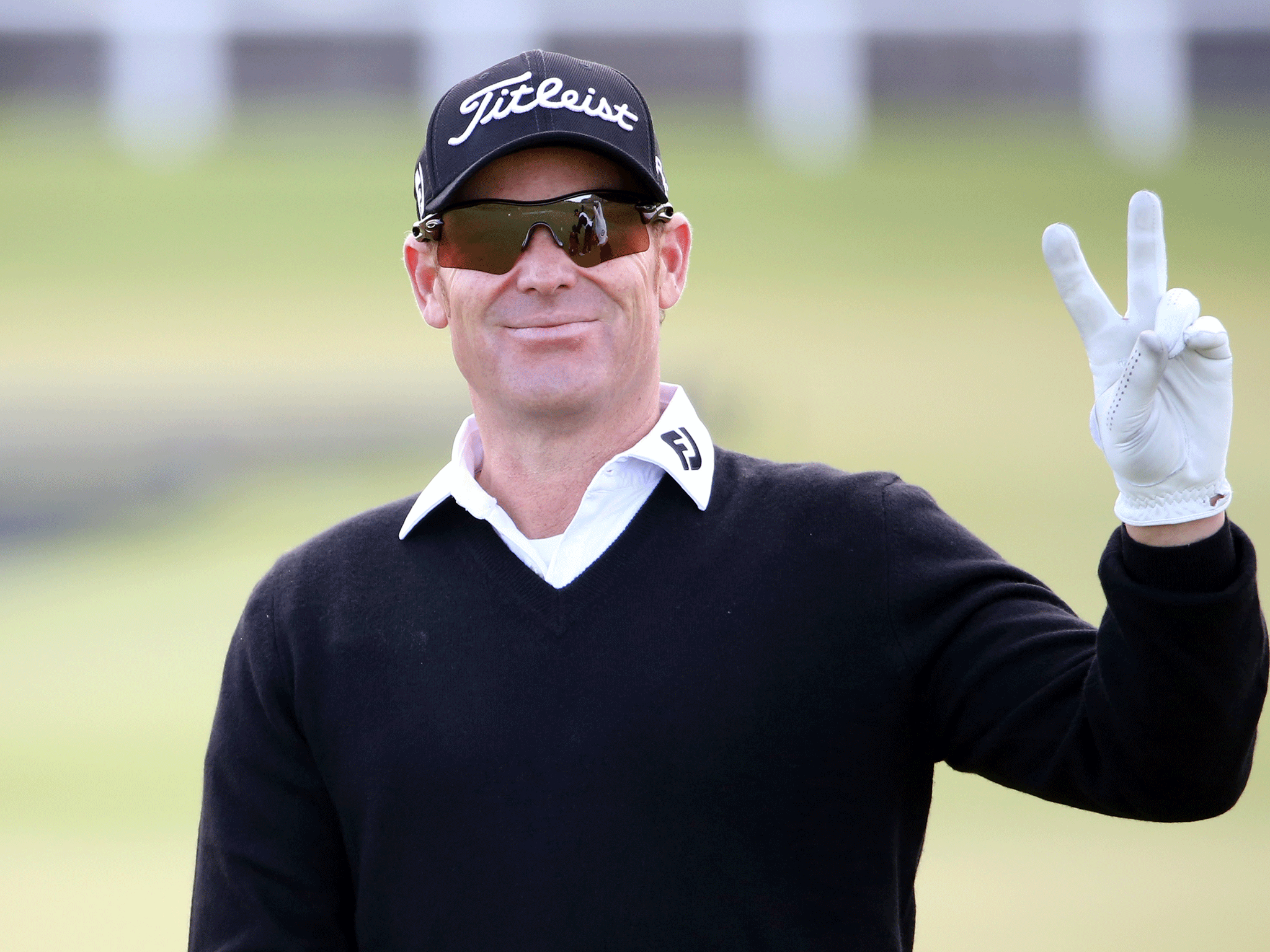 ST ANDREWS, SCOTLAND - SEPTEMBER 26: Former Australian cricketer Shane Warne gestures as he takes part in The Alfred Dunhill Links Golf Championships on The Old Course. GETTY IMAGES