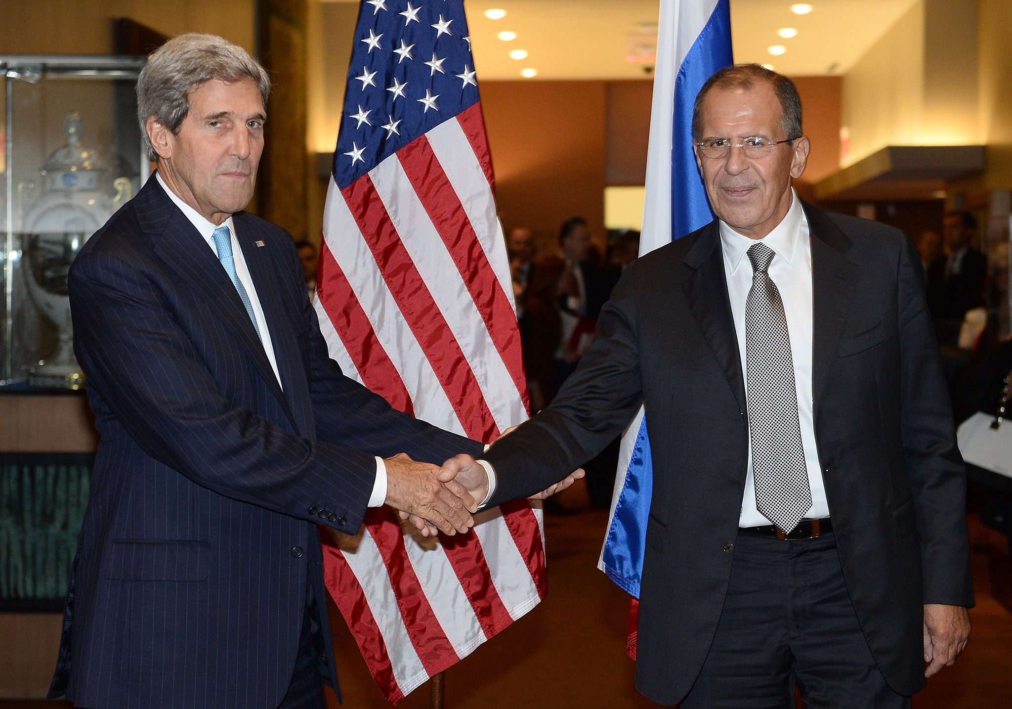 US Secretary of State John Kerry shakes hands with Russian Foreign Minister Sergey Lavrov
