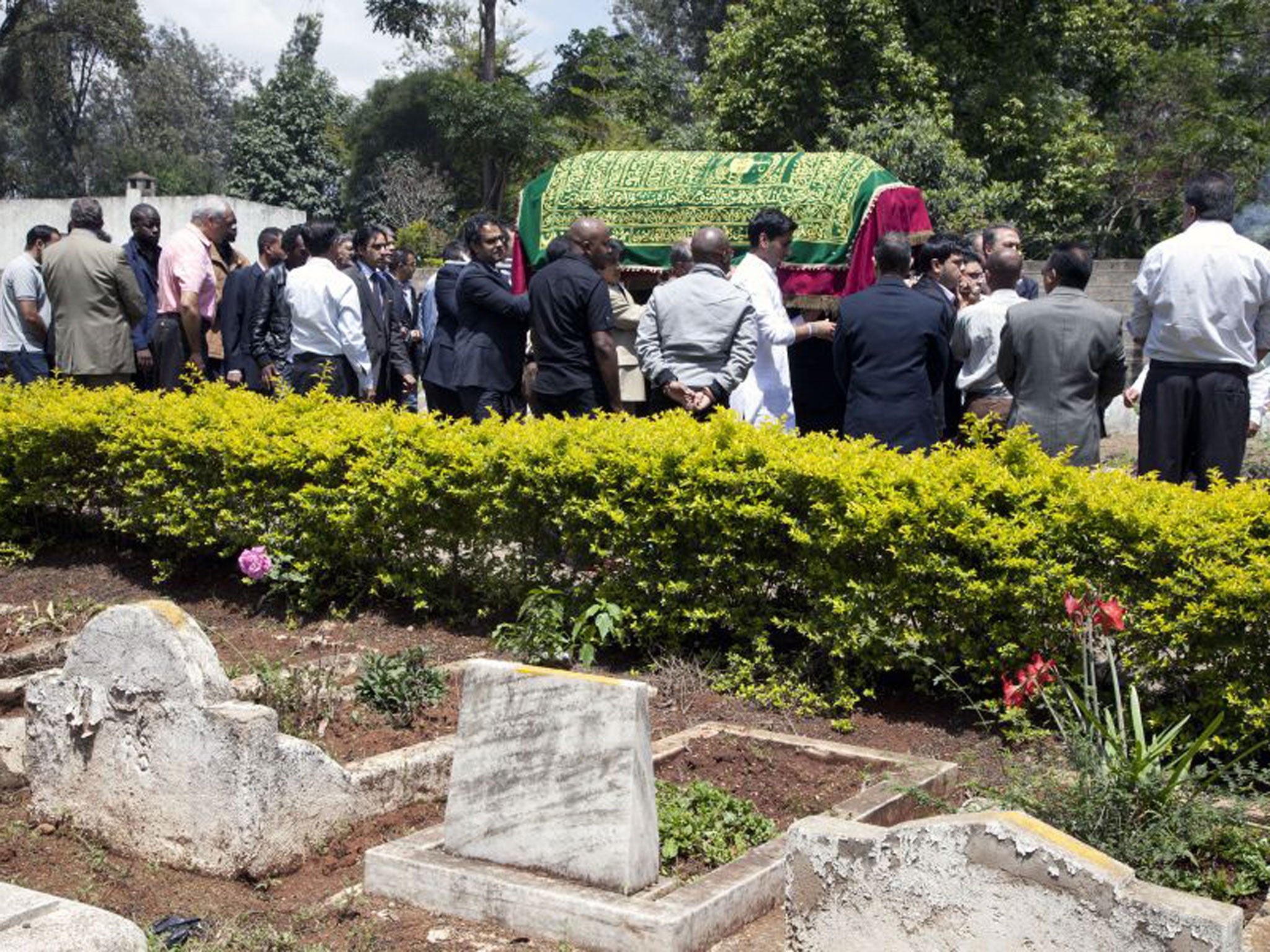 Mourners at the funeral of radio presenter Ruhila Adatia Sood
