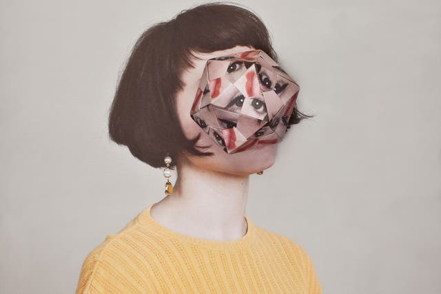 Haser's photographs are made by photographing the subject, then printing multiple copies of the sitter's face and folding them into origami structures. That is then placed over the original face and the whole construct is photographed again.