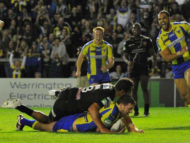 Simon Grix goes over for his first and Warrington’s third try