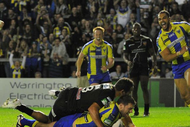 Simon Grix goes over for his first and Warrington’s third try