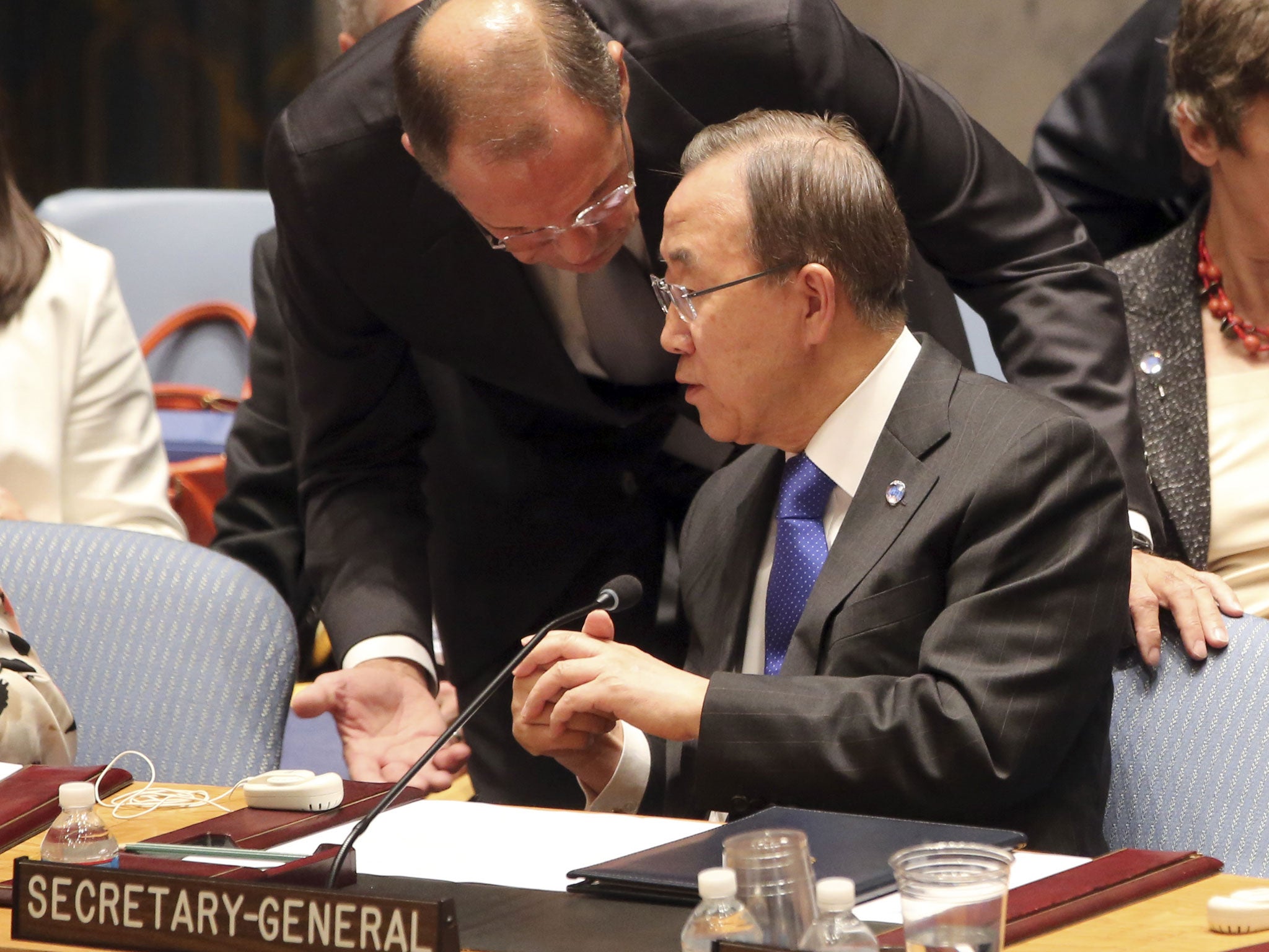 Russian Foreign Minister Sergey Lavrov speaks to United Nations Secretary-General Ban Ki-moon before the start of the Security Council meeting