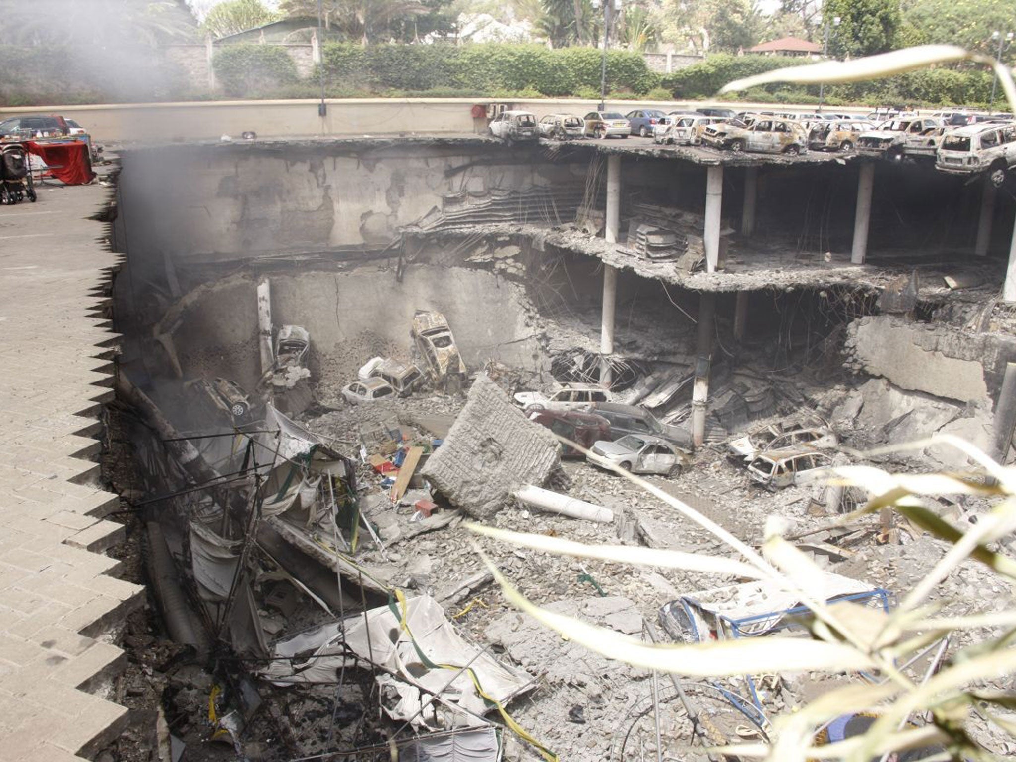 Photo released by the Kenyan Presidential office, showing the remains of cars and other debris photographed from the rooftop of the car park outside the Westgate Mall on 26 September