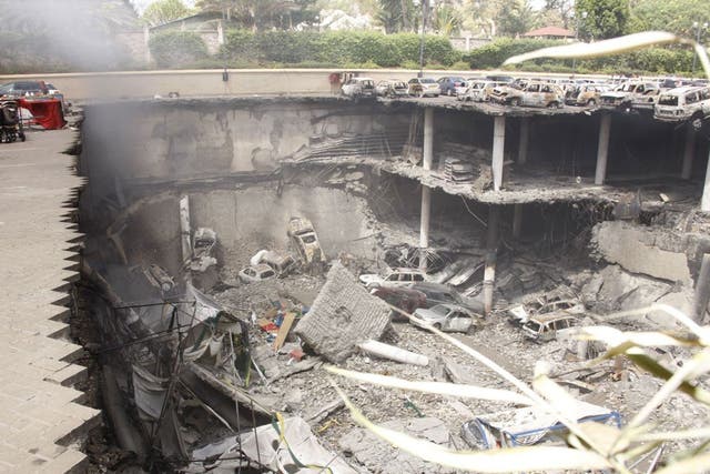 Photo released by the Kenyan Presidential office, showing the remains of cars and other debris photographed from the rooftop of the car park outside the Westgate Mall