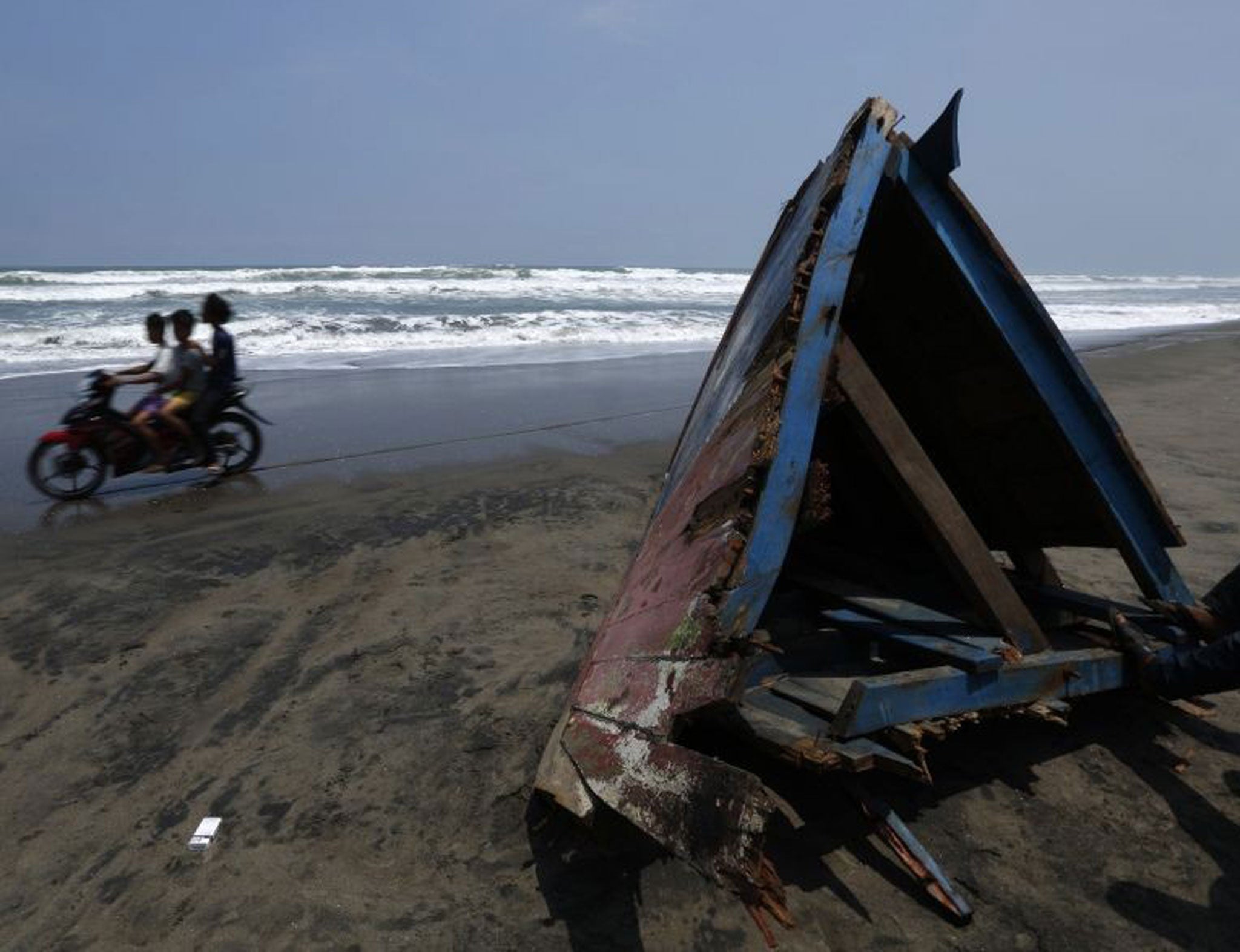 A piece of the boat's wreckage washed up on an Indonesian beach