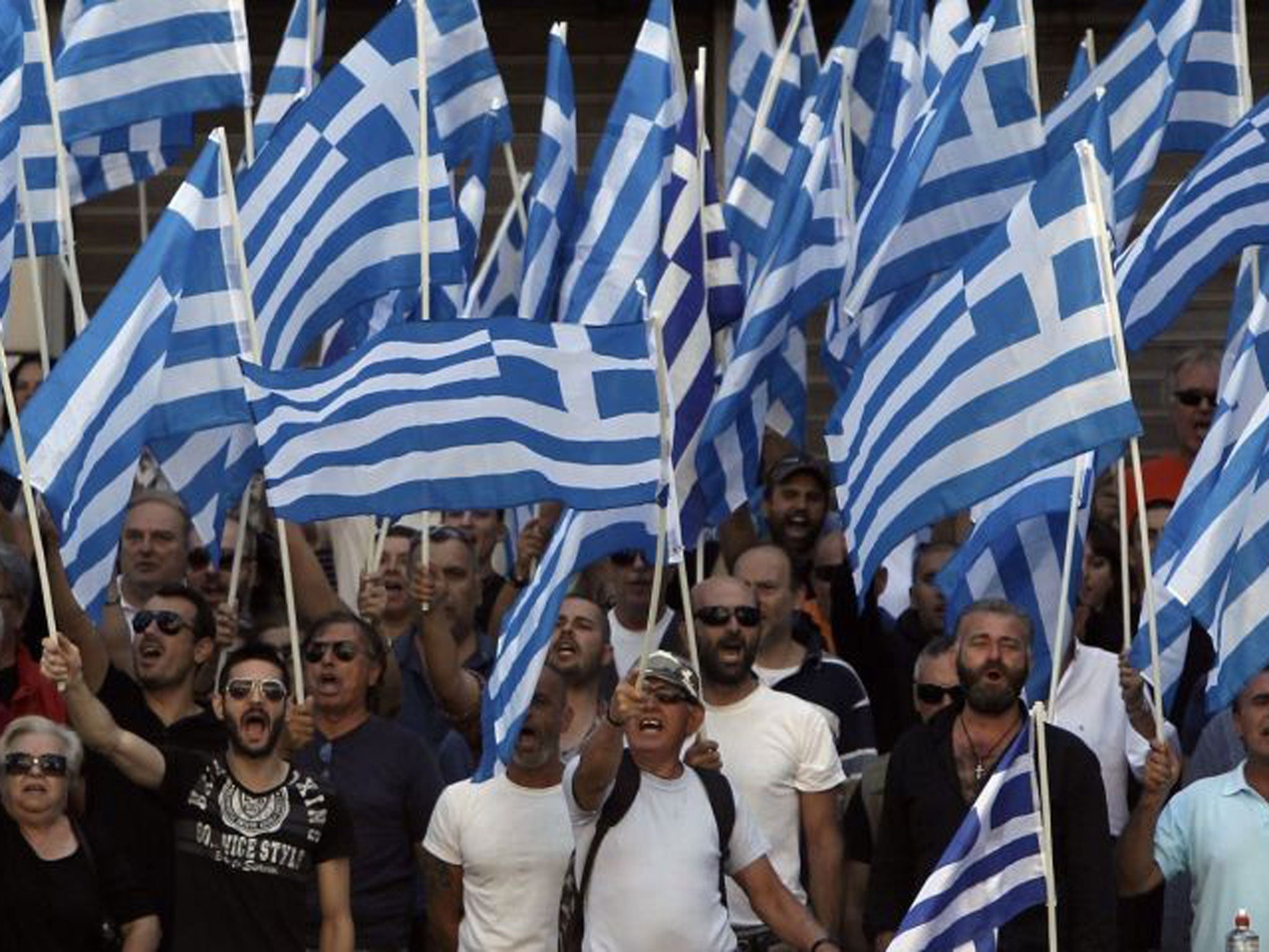 Far-right anger: Golden Dawn protest outside Athens police headquarters yesterday