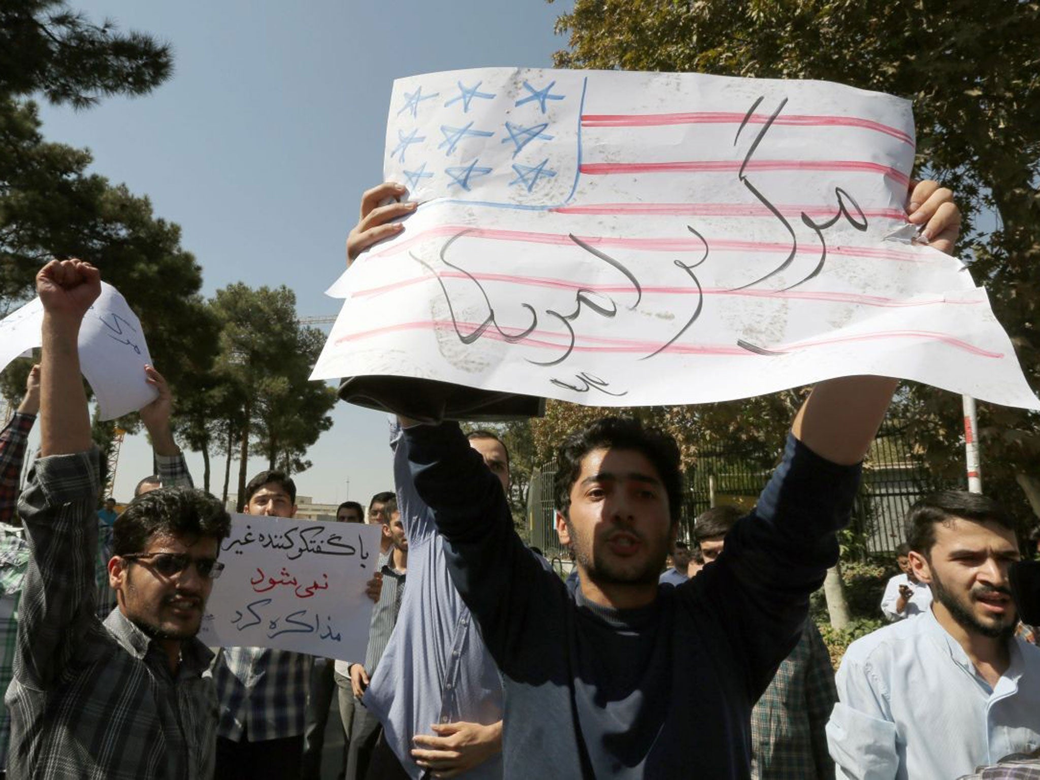One of the anti-US placards greeting Rouhanin Tehran yesterday