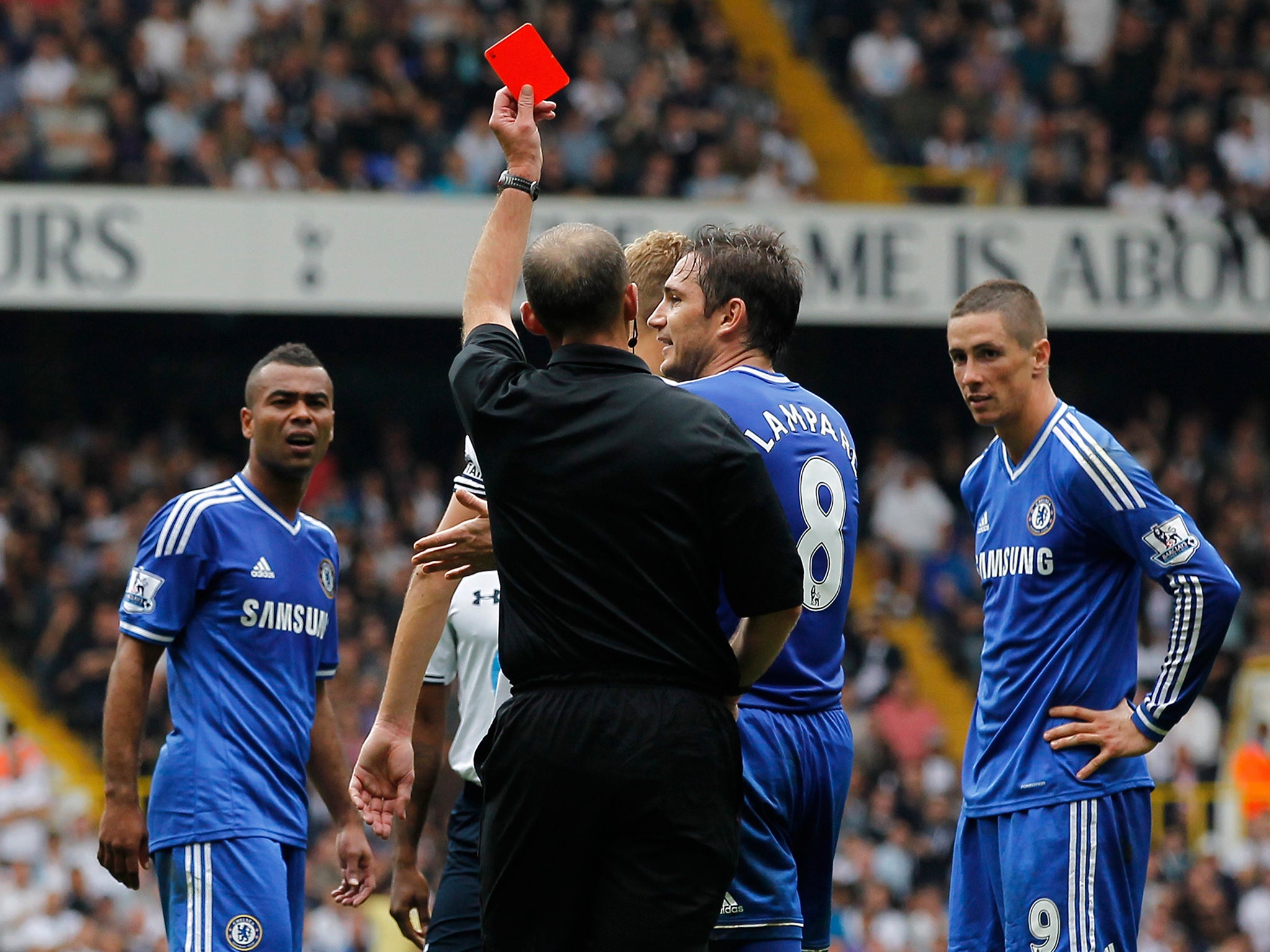 Fernando Torres is sent off by referee Mike Dean