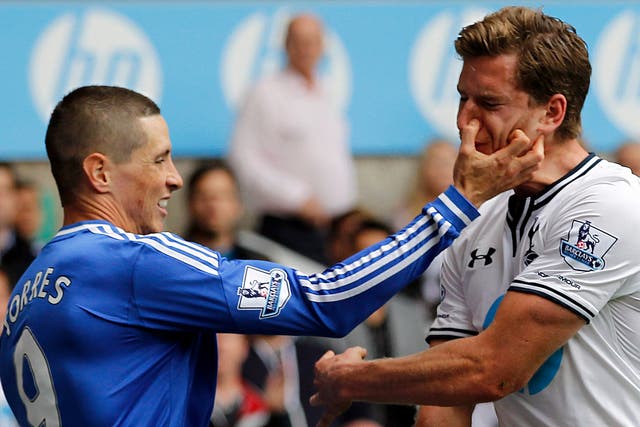 Chelsea's Fernando Torres clashes with Jan Vertonghen of Tottenham