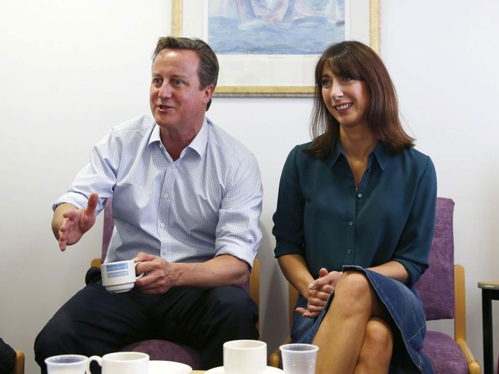 Reaching out: The Camerons in Oxford yesterday