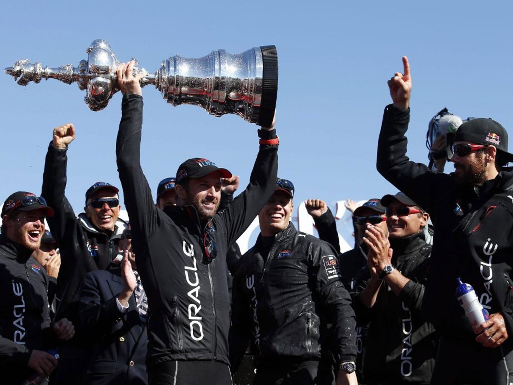 Ben Ainslie collects the mammoth Americas Cup trophy last year