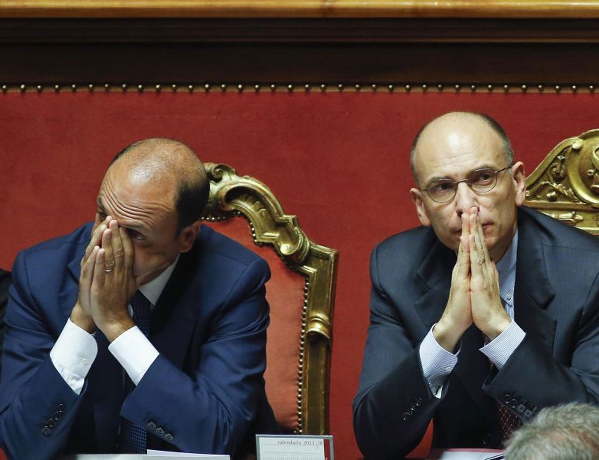 Italy's Prime Minister Enrico Letta (right) and Interior minister Angelino Alfano