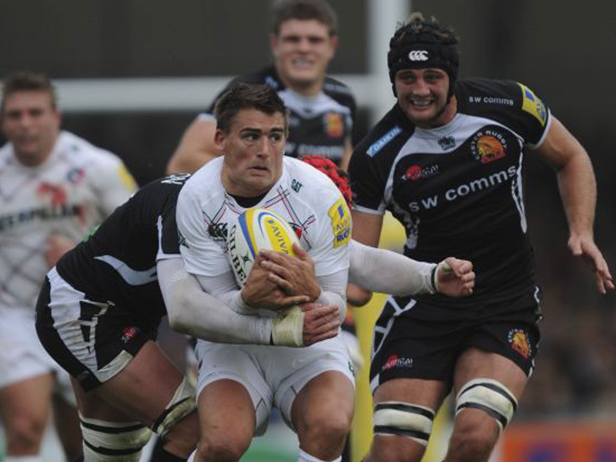 Tom Johnson of Exeter tries to get to grips with Leicester’s Toby Flood