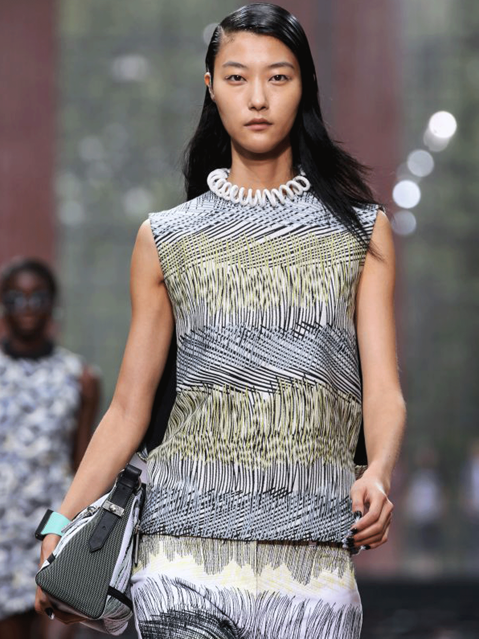 PARIS, FRANCE - SEPTEMBER 29: A model presents a creation for Kenzo during the 2014 Spring/Summer ready-to-wear collection fashion show. GETTY IMAGES
