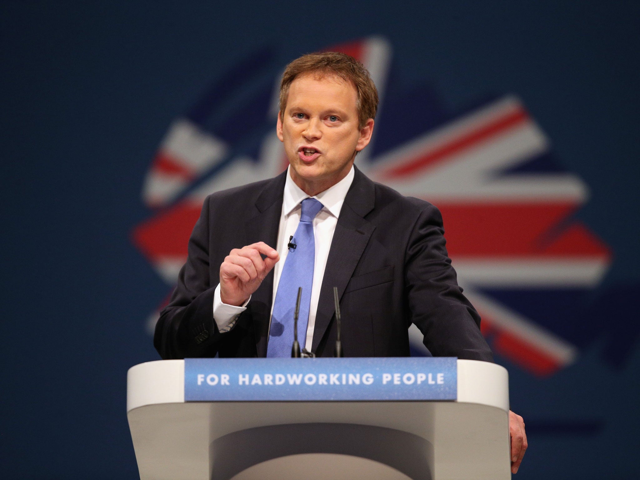 Conservative party Co-Chairman Grant Shapps delivers his speech in the main hall on the first day of the Conservative Party Conference